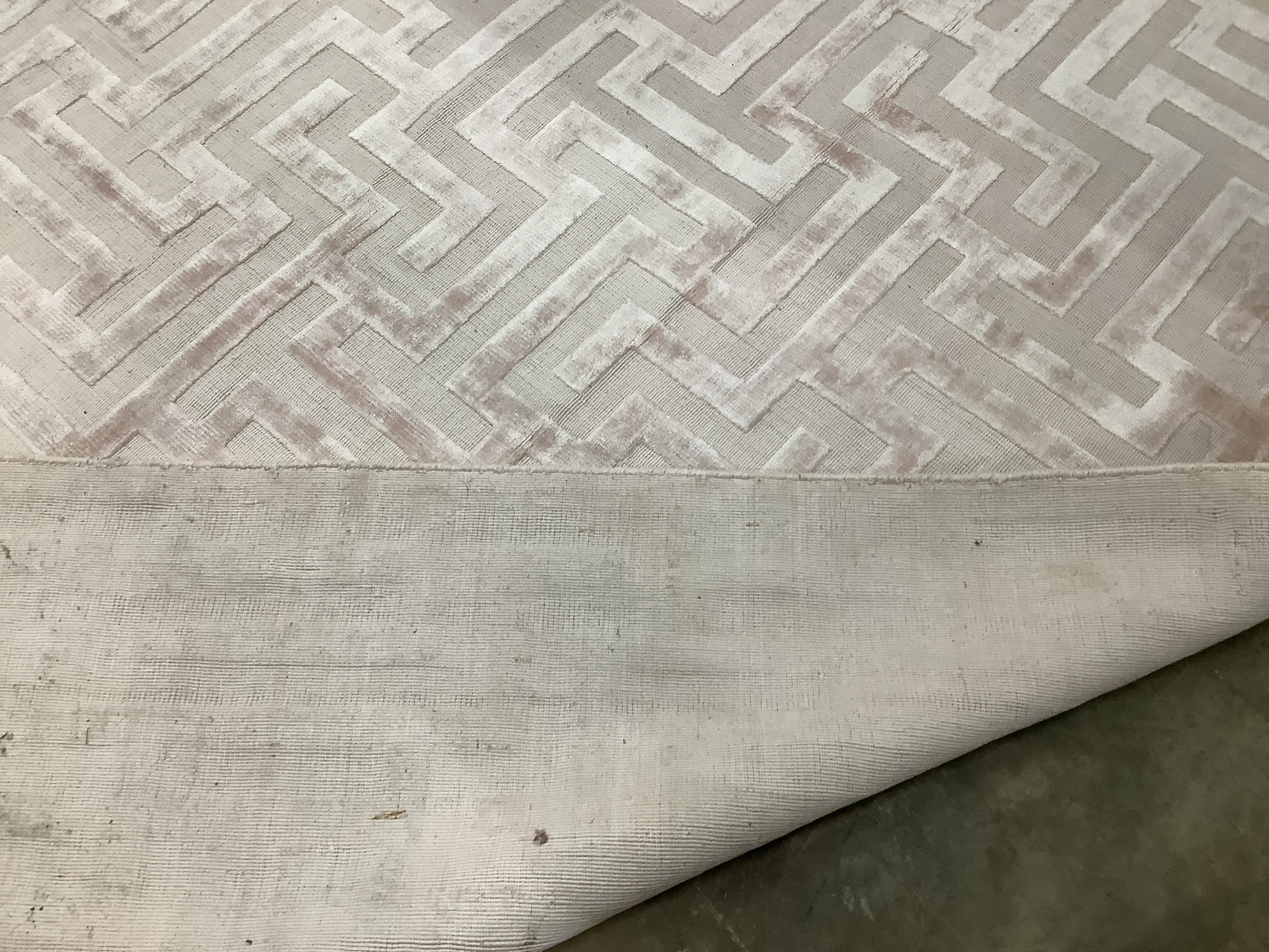 A contemporary part silk peach geometric carpet, 300 x 200cm